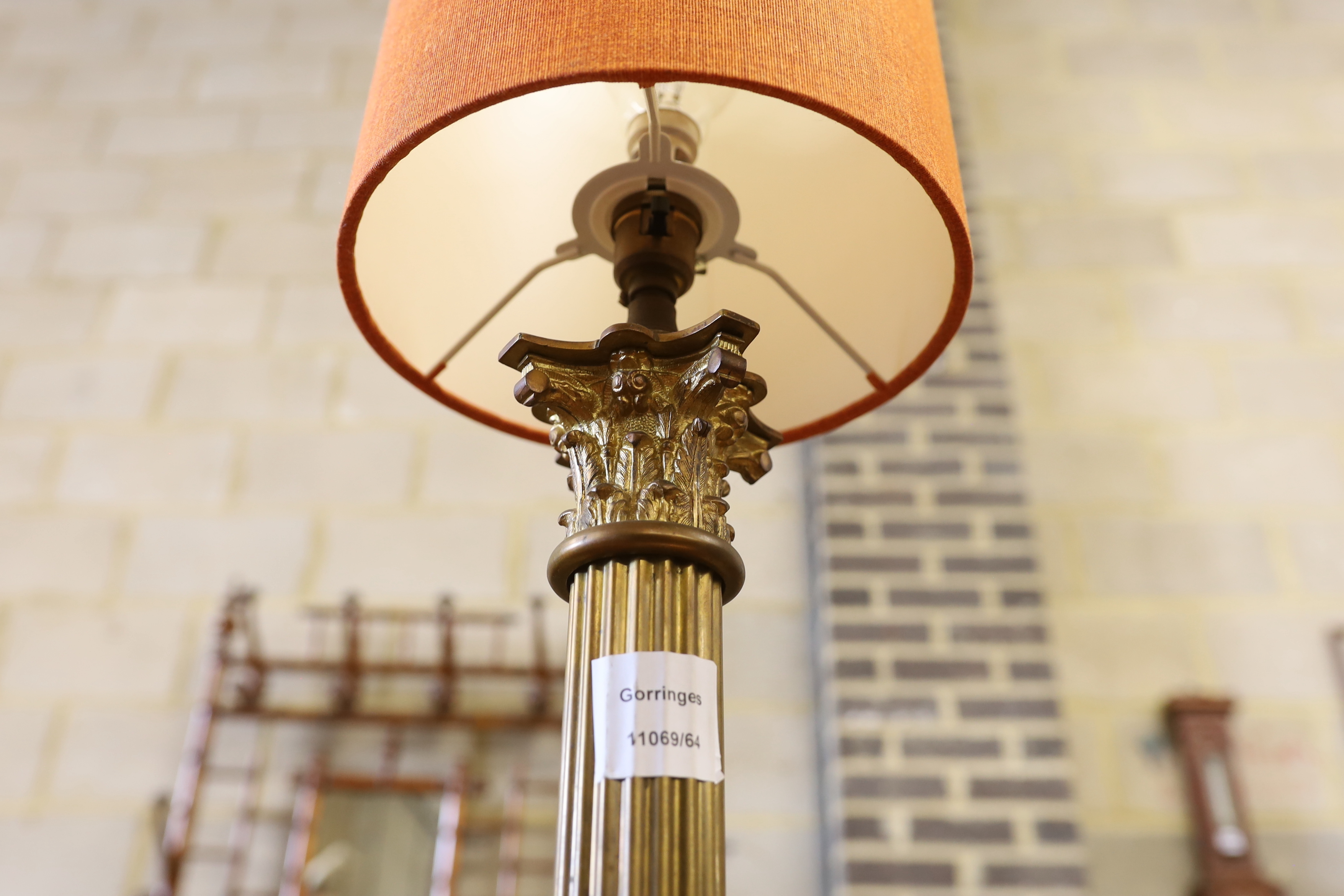 A brass Corinthian column table lamp, height including shade 76cm